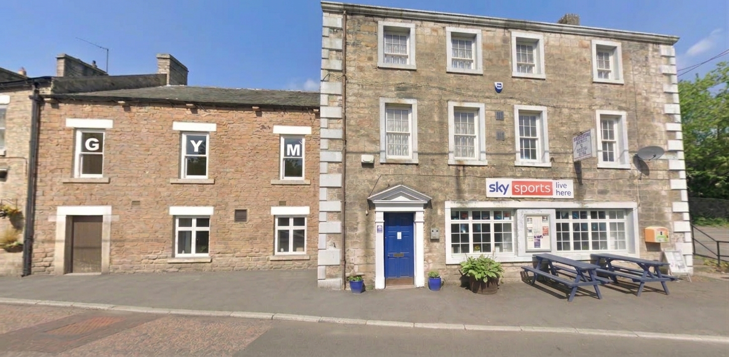 The front of the Sports & Social Club on Rose Terrace, with the letters G, Y and M in the gym's upstairs windows